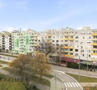 Apartment buildings on Hlavná Street in Galanta surrounded by greenery and road infrastructure.