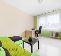 A bright room with a desk and a sofa, 3-room apartment.