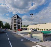 Visualization of an apartment building on Moravská Street in Vráble, surrounded by a parking lot and greenery.