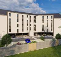 The building on Moravská Street in Vráble, surrounded by greenery, intended for commercial purposes.