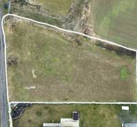 Aerial view of residential plots in the town of Kuzmice, on a quiet street.