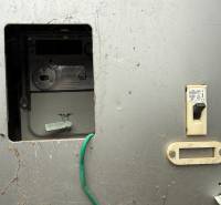 Electric meter and circuit breaker on the wall in the garages.