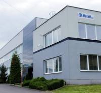 Building on Trenčianska Road in Nová Dubnica with administrative warehouses and halls.