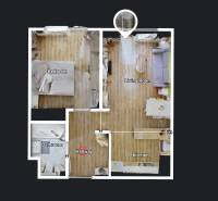 Floor plan of a 2-room apartment with a living room, kitchen, bedroom, and bathroom. Floor with wood decor.