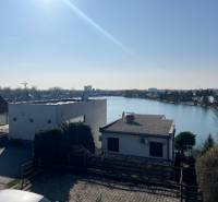 View from the cottage at Sunny Lakes in Senec, with a calm water surface.