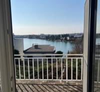 View from the cottage at Sunny Lakes in Senec with wooden floor decor.