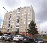 Apartment building on Čergovská Street in Prešov with a parking lot in the foreground.