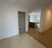 Interior of a family house with a wooden decor floor and wooden doors.
