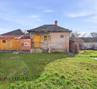 A family house in Vrakúňa with a grassy plot and a garage. Residential plots.