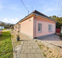 A family house in Vrakúňa, suitable for residential plots, with a landscaped yard.