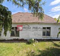 Family house in Dolné Orešany with a garden and greenery, older roof, needs renovation.