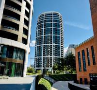 Modern residential buildings, landscaped sidewalks, and greenery in Bratislava - Staré Mesto.