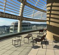Terrace with a view of the city, stylish chairs and tables, terrace in Bratislava.