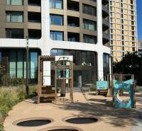 Children's playground in Bratislava - Old Town in front of a modern residential building.