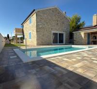 Family house in Vrsi with stone cladding and a pool on the terrace on Vrsi street.