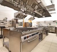 A professional kitchen with stainless steel equipment and a variety of appliances in commercial premises.