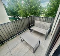 A balcony with seating and a view of the trees, a 2-room apartment on Golfová Street, Hrubá Borša.