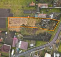 Aerial view of plots - housing in Holice, bordered by an orange line.