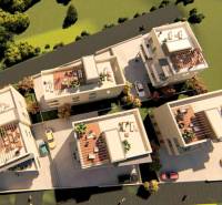 Aerial view of a complex with 2-bedroom apartments in Petrčane surrounded by greenery.