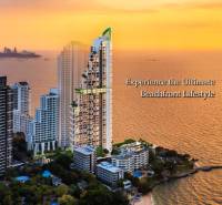 A view of apartment construction in Pattaya with a sea view at sunset.