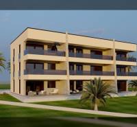 A three-story building in Nin surrounded by greenery and palm trees, overlooking a quiet street.