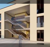 Exterior of a building with a modern staircase and a parked car, suitable for 2-bedroom apartments.