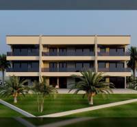 A building with loggias, surrounded by well-maintained greenery and palm trees in the city of Nin.