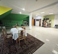 Interior of a family house with a dining table and colorful accents on the walls.