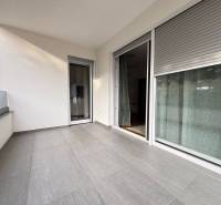 The balcony of the holiday apartment in Novalja, fully covered with a view, gray tiles.