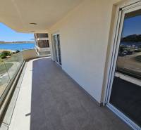 Balcony of a holiday apartment in Povljana with a view of the sea and harbor.