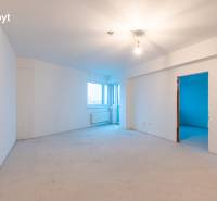 Unfurnished 1-bedroom apartment with basic wall and ceiling finishes, without flooring.