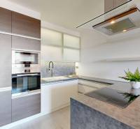 A kitchen in a 3-room apartment with an induction cooktop and built-in appliances.