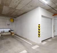 Parking space and garage, Jána Stanislava, Bratislava - Karlova Ves, next to storage boxes.