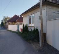 A family house in Siladice with a traditional roof and plaster, along a quiet street.
