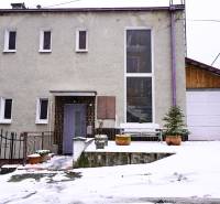A family house on Gogoľova Street in Trenčianske Teplice with a snow cover.