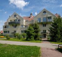 Apartment building with balconies in Nitra on Južná Street, in a green area.