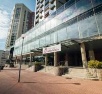 Glass buildings and an ambulance on Kopčianska Street in Bratislava - Petržalka.