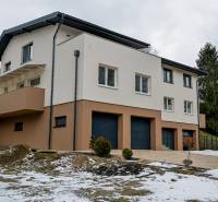 A family house insulated with a double garage in the snowy landscape of Stará Ľubovňa.
