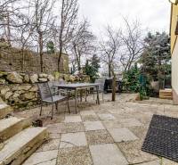 The terrace of a family house on Medzierka in Bratislava - Old Town with outdoor seating and a grill.