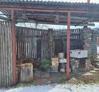 A wooden extension in the yard of a family house on Slnečná Street in Spišský Štiavnik in winter.