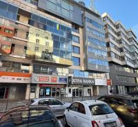 Exterior of offices on Dunajská Street in Bratislava - Old Town, with a parking lot.