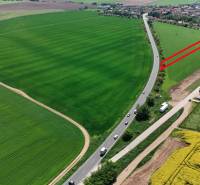 Aerial view of green fields around Družstevná Street, Blatné, Land - residential.