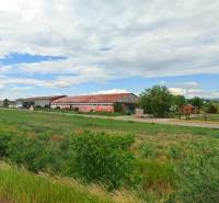 Landscape with a building and water tower on Družstevná Street, Blatné, Land - residential.