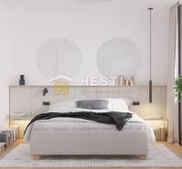 Bright bedroom with a comfortable double bed and a large window in a family house.