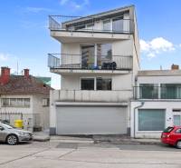 The exterior of a three-story building with balconies on Ďumbierska Street in Bratislava - Vinohrady.