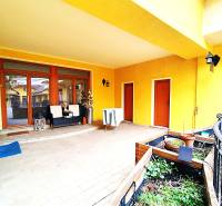 Terrace at a 2-room apartment on Potočná Street in Skalica with plants and seating.