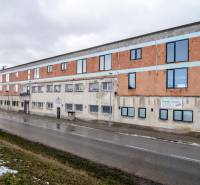 Building on Nádražná Street in Šenkvice, designated for warehouses and halls.