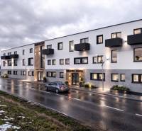 The building on Nádražná Street in Šenkvice, Warehouses and Halls, with evening lighting.
