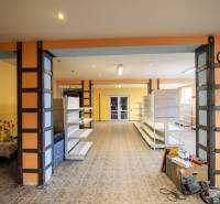 Interior of a warehouse with shelves and a floral motif on the wall, Warehouses and halls.