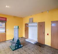 Space with yellow walls and metal racks in warehouses and halls.